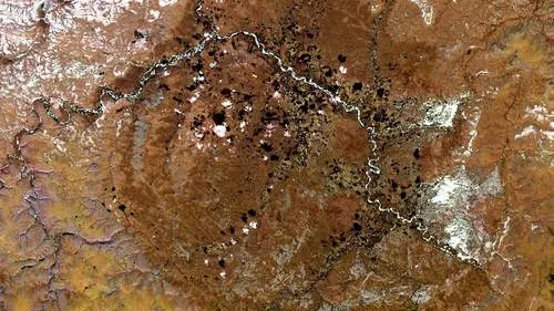 Фото: Спутниковая фотография кратера Попигай/NASA